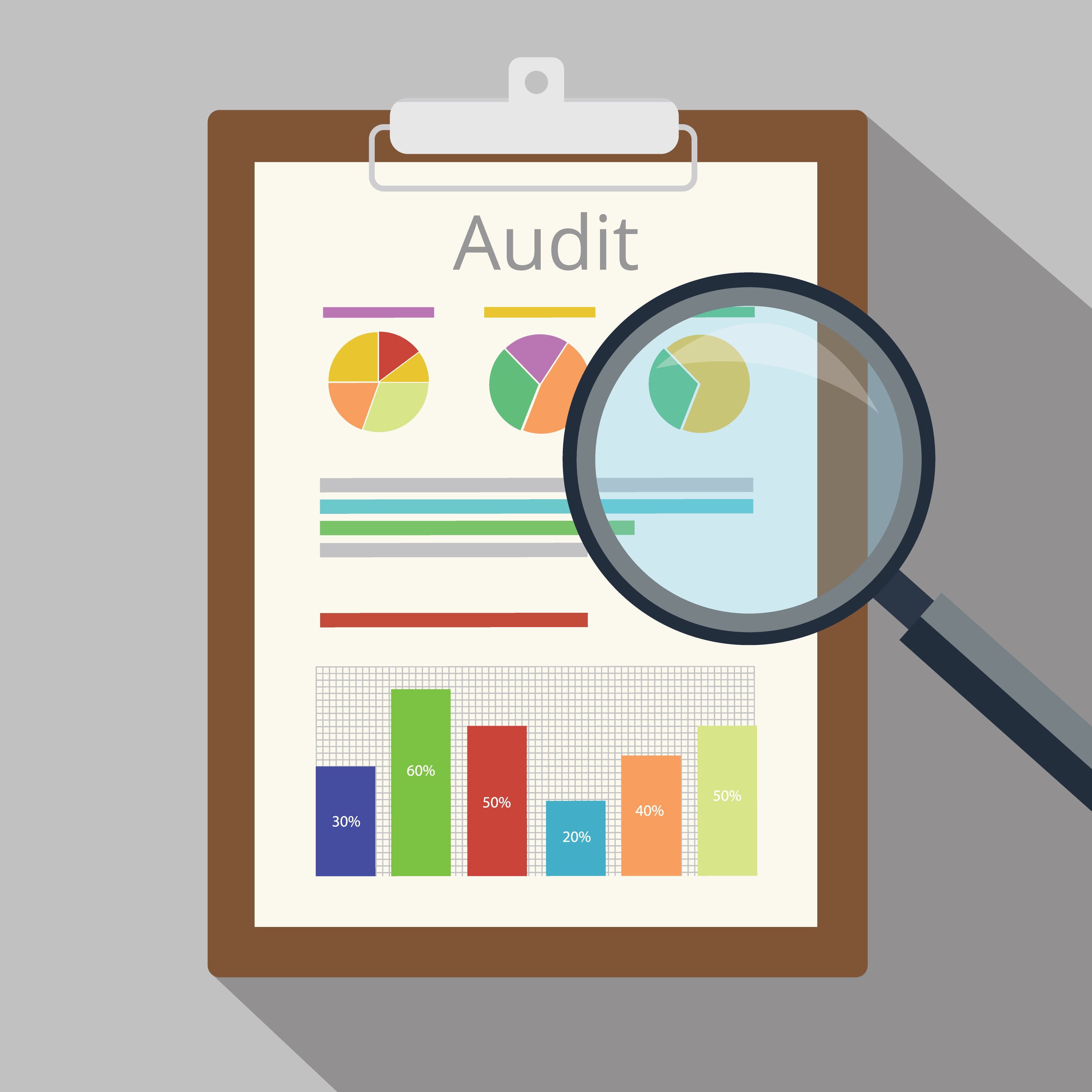 magnifying glass over an audit sheet
