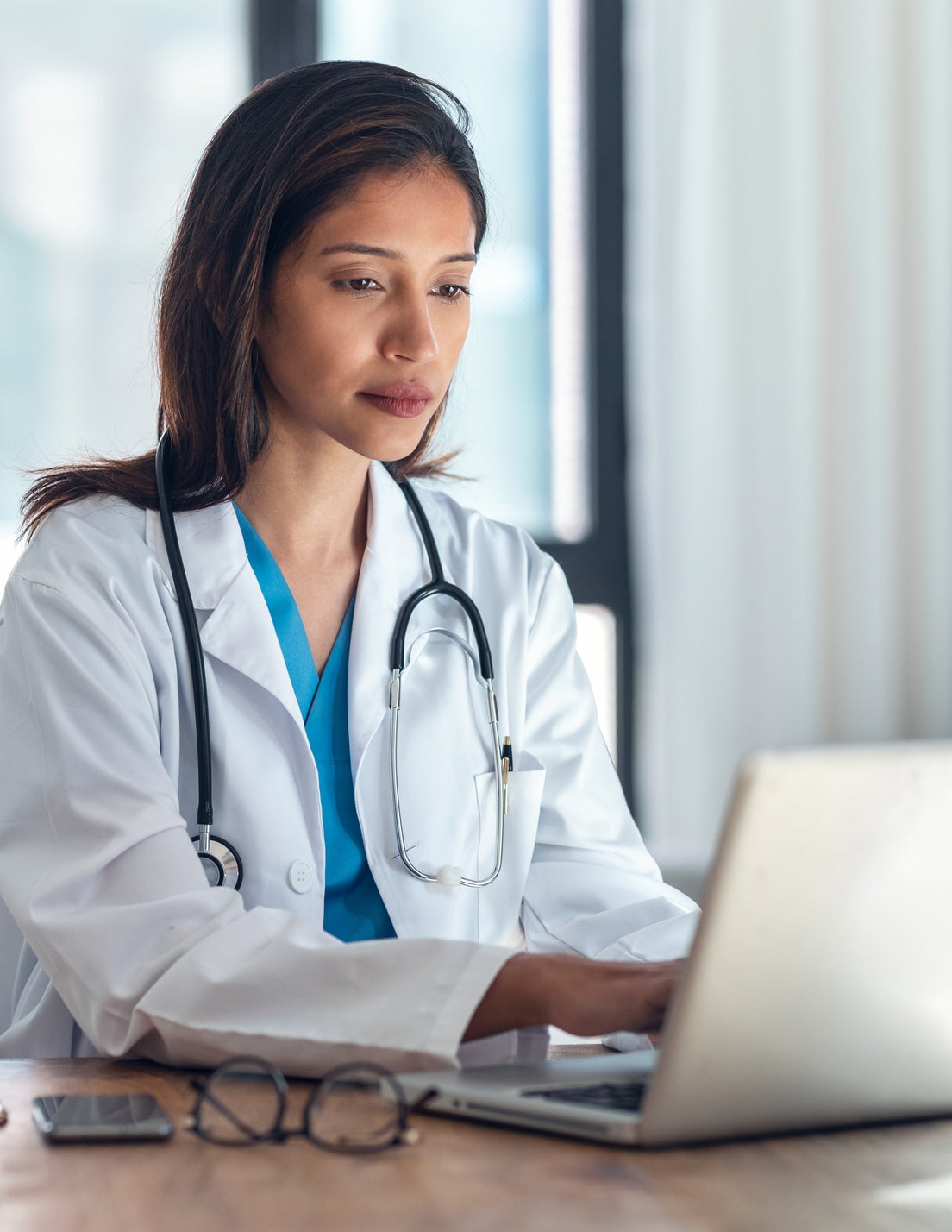 Young doctor typing
